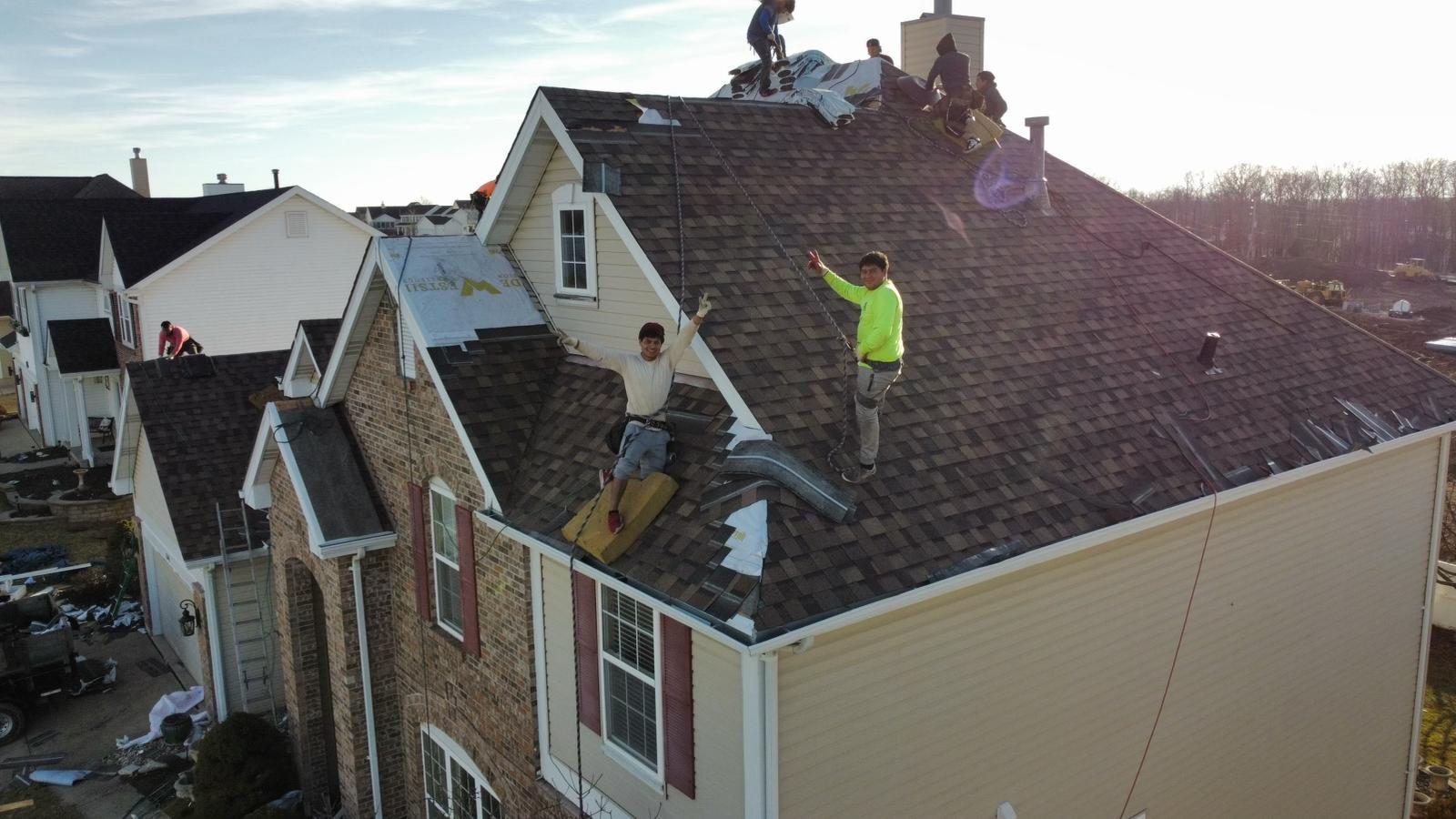Two workers continuing install
